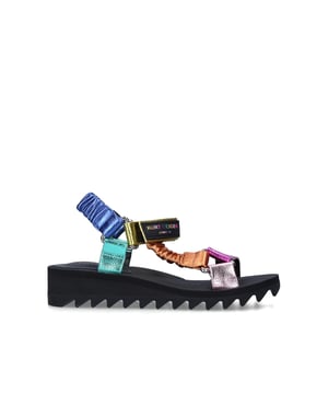 The Orion sandal is a open style with multi-colour ruched straps across the foot. The velcro strap is topped with rubber branded patch. Sole height: 4cm. Black treaded sole.