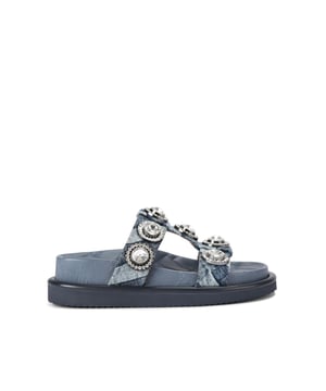 The Orson Crystal Sandal arrives in a denim fabric with quilted effect. The strap is topped with oversized crystals. Overstitched quilted insole with padding, seen across the collections.