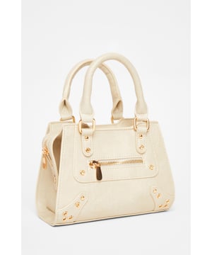 - Faux leather - Top handle - Zip closure - Detachable strap