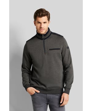 Der Sweat-Troyer ist aus einer kleinen mehrfarbigen Struktur gefertigt. Dieser kann mit geschlossenem Reißverschluss als moderner Stehkragen getragen werden, aber auch mit geöffnetem Reißverschluss macht der Troyer eine gute Figur. Der Baumwoll-Elasthan-Mix macht das Kleidungsstück besonders bequem und bietet viel Bewegungsfreiraum.