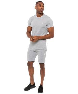 Stay stylish and comfortable with this Enzo set. The muscle-fit T-shirt, made from extra stretch fabric, features a crew neck, short sleeves, and embroidered logo. The fleece shorts include an elasticated drawstring waist, two pockets, and matching logo embroidery. Perfect for workouts, weekends, or casual wear.
