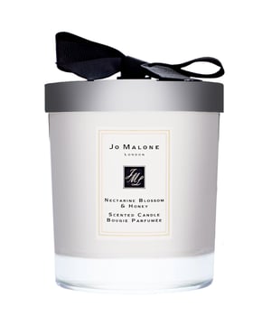Indulge in the exquisite Jo Malone Nectarine Blossom & Honey Candle, a luxurious addition to your home fragrance collection. Launched in 2005, this beautiful candle features a captivating blend of fruity and floral notes. It opens with the vibrant scent of Cassis, followed by a heart of sweet Acacia Honey, and finishes with the luscious aroma of Peach. Enjoy up to 45 hours of enchanting burn time. This elegant candle is beautifully packaged with a decorative lid and measures H9.2 x W7.5cm. Please note that packaging may vary, and matches are not included.