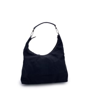 VINTAGE, RRP AS NEW
Effortlessly sleek with a minimalist edge, this vintage Gucci hobo bag is crafted in black nylon canvas and finished with black leather trim and handle-a timeless mix of casual elegance and iconic Italian design.  The silver-tone hardware adds a subtle shine, while the upper zipper closure reveals a black fabric-lined interior with a single side zip pocket for everyday essentials. Inside, the signature 'Gucci - Made in Italy' tag is stitched in place, with the serial number on the reverse-a mark of its ity and heritage.  Comfortable on the shoulder and effortlessly stylish, this Gucci hobo is a quiet classic designed to carry your essentials with understated luxury.  Condition Rating: B - VERY GOOD CONDITIONCondition Details: Gently used. Some wear of use on leather handle (light white marks). Please check the photos carefully and ask if you need to know more details or if you have any doubts.Measurements (cm):Depth: 14.0Height: 35.6Length: 35.6Other Details: Dustbag? NoKeys? NoBox? No Measurments:  width: 140 mm length: 356 mm height: 356 mm strap length: 0 mm handle drop: 0 mm