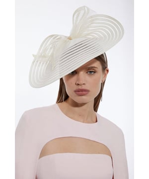 Get dressed up and finish the look with a fascinator, with a statement, large size and bow detailing, fitted onto a comfortable headband. Styles perfectly with a dress or pantsuit in matching tones for a look ideal for wedding guest days and days at the racecourse. Bow Detail Fascinator On Trend, Three Dimensional Bow Detailing Sheer, Asymmetric Disc Base Statement Large Size Easy to Wear HeadbandBrowse this seasons women's fascinators or discover the full range of women's accessories now.