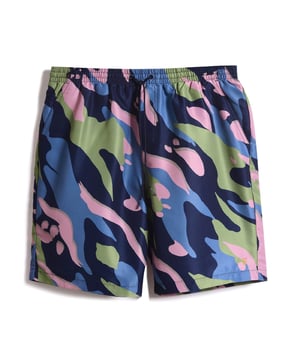 Hit the water in style with the Colbert Swim Shorts. Designed for both comfort and style  they feature a contrast colour external drawcord for a secure fit and an internal mesh lining for quick-drying comfort. Keep your essentials close with two convenient side pockets  a back patch pocket with secure Velcro fastening  and a discreet internal coin pocket.These shorts are an all over print design with a signature logo and are complete with Farah branding.