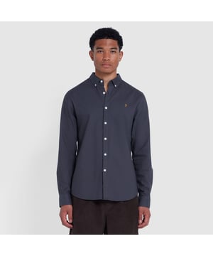 Button down shirt collar.Long sleeves.A locker loop on the reverse with a central pleat. Signature Farah logo is embroidered on the left of the chest.Curved hem.