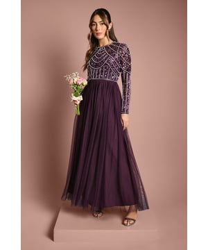 If a showstopping bridesmaid gown is what you're looking for, you're in the right place. Featuring a bodice swathed in dazzling sequins that glimmer in an art-deco pattern under the light, this design is finished by a delicate tulle skirt, adding to the sophisticated, old-time glamour aesthetic. Made from embellished sequins: exquisitely ornated with hand-sewn beads, this luxurious fabrication has a heavyweight feel, encasing your figure for a sculptural silhouette. Every unique pattern is created exclusively in-house by a team of artists. Level of stretch: none. This dress fastens with a rear concealed zip.This style is part of the Coast Honoured Collection, a dedicated range of never out-of-stock, bridesmaid dresses guaranteed to favour every member of your bridal party. Available in a selection of bestselling colour palettes, perfect for mix-and-match groups.