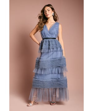 Elegant sleeveless maxi dress with flattering wrap-style bodice and plunging V-neckline
        Striking tiered design with textured mesh panels creating beautiful dimension and movement
        Defined waistband with contrasting belt detail to accentuate the silhouette
        Delicate mesh fabric offers a lightweight, ethereal quality perfect for special occasions
        Floor-length design with graceful flowing skirt for a sophisticated finish
    
    Make a captivating entrance at your next formal event in this stunning Coast maxi dress. The sleeveless design with its wrap-style bodice creates a beautifully feminine silhouette, whilst the dramatic tiered skirt adds texture and visual interest. The contrasting waistband cinches the figure perfectly, creating an hourglass shape that flatters all body types. Style with strappy heels and statement earrings as shown for a refined look that's perfect for weddings, race day events or evening galas. The lightweight mesh construction ensures comfort throughout your special occasion, whilst the intricate detailing reflects Coast's commitment to sophisticated design. This versatile piece can be dressed up with a tailored blazer for cooler evenings or worn as is to showcase its exquisite craftsmanship.