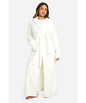 Cosy fleece dressing gown with charming heart print
        Long length for full-body warmth and coverage
        Spacious hood for extra comfort and style
        Wide sleeves for ease of movement
        Adjustable waist tie for a customised fit
    
    Wrap yourself in comfort and style with this delightful fleece dressing gown. Perfect for those chilly mornings or relaxing evenings, this robe combines practicality with a touch of whimsy. The all-over heart print adds a playful element to your nightwear collection, making it ideal for lounging around the house or preparing for a good night's sleep. Pair it with your favourite pyjamas or nightdress for a complete bedtime ensemble. The long length and roomy hood offer extra warmth, while the wide sleeves allow for unrestricted movement as you go about your evening routine. Whether you're enjoying a cup of tea before bed or settling in for a cosy night of binge-watching, this dressing gown is your go-to for ultimate relaxation and comfort.