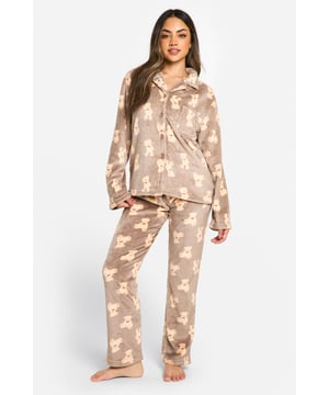 Adorable bear print fleece pyjama set
        Button-up top with notched collar
        Long sleeves for extra warmth
        Matching full-length trousers
        Soft and cosy fleece fabric for ultimate comfort
    
    Embrace the ultimate in loungewear luxury with this charming bear fleece pyjama set from Boohoo. Perfect for those chilly nights in or lazy weekend mornings, this set combines style and comfort effortlessly. The button-up top features a classic notched collar and long sleeves, while the matching full-length trousers ensure you're snug from head to toe. The playful bear print adds a touch of whimsy to your nighttime routine, making bedtime something to look forward to. Pair with fluffy slippers and a warm dressing gown for the complete cosy ensemble. Whether you're having a movie marathon or enjoying a leisurely breakfast in bed, this pyjama set is your go-to for relaxation and style. It's also an ideal gift for the fashion-forward friend who values both comfort and cuteness in their loungewear collection.