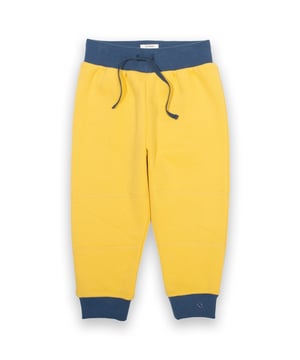 100% organic cotton | Proud to be certified to the Global Organic Textile Standard (GOTS) | Sweetcorn yellow | Brush back sweat fabric 3 ply (290-300 gsm) | Ribbed cuffs | Ribbed elasticated waistband with adjustable ties | Flying Kite embroidery at hem | Single needle cross patches on knees | Made in Turkey | Machine washable at 40 degrees, or at 30 degrees to be kinder to the planet