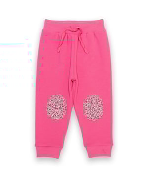 100% organic cotton | Proud to be certified to the Global Organic Textile Standard (GOTS) | Blush pink | Brush back sweat fabric 3 ply (290-300 gsm) | Ribbed cuffs | Ribbed elasticated waistband with adjustable ties | Flying Kite embroidery at hem | Contrast knee patches featuring our sweet ditsy all-over print | Made in Turkey | Machine washable at 40 degrees, or at 30 degrees to be kinder to the planet