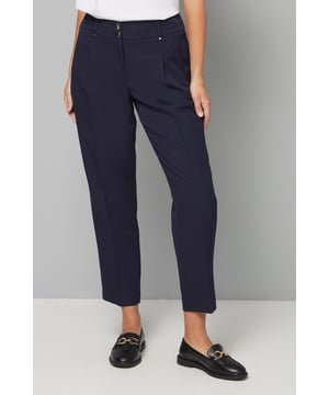 Elegant tapered leg design for a flattering silhouette
        Sophisticated double button fastening with clean front closure
        Streamlined fit with subtle pleating detail at the waist
        Versatile ankle-grazing length perfect for showcasing footwear
        Designed specifically for petite frames with proportioned measurements
    
    These smart tapered trousers from Wallis are the cornerstone of a sophisticated wardrobe. The elegant tapered silhouette creates a refined look whilst the slight stretch in the fabric ensures all-day comfort without compromising on style. Style them as shown with a crisp white top and structured blazer for boardroom meetings or important presentations. For evening occasions, pair with a silky blouse and pointed court shoes to project confidence and poise. The versatile ankle length works beautifully with both flats and heels, making these trousers an essential for your work-to-weekend rotation. Their clean lines and tailored appearance make them ideal for those moments when you need to look polished and professional without fuss. A true wardrobe hero that will serve you through multiple seasons.