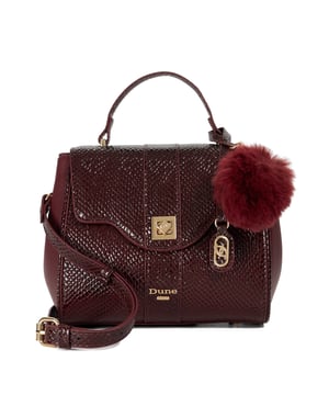 Dassios is the chic day bag that balances polish with practicality. Crafted with a contrasting textured side panel for a subtle style twist, it features a sleek turn-lock closure and a structured top handle for timeless appeal. Inside, the monogrammed lining reveals two spacious compartments ' one zipped for added security ' keeping your essentials neatly organised. Carry it by hand for a sophisticated look, or attach the optional long strap for a hands-free cross-body style. Finished with a removable logo and plush faux-fur pom-pom charm, Dassios is your go-to for effortless everyday elegance