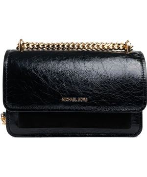 Indulge in the luxury of the Michael Kors Claire, a masterpiece designed in sumptuous black leather, this compact crossbody bag boasts a sleek silhouette adorned with gleaming gold hardware and the iconic Michael Kors signature branding. A magnetic closure secures your essentials, while an internal zip section keeps items organised. The golden chain shoulder strap adds a dash of opulence, making it an impeccable choice for both day and evening wear.
