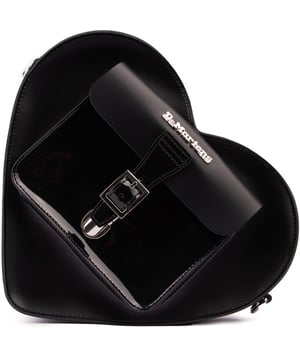 The vibrant Heart bag from Dr. Martens is toughened up to DM's levels and a sweet accessory with attitude. The crowd-favourite silhouette, in high-quality Kiev leather, is fitted with a front zip pocket and a zipped main compartment to keep essentials secure. The heart-shaped bag has two adjustable straps for a comfortable fit, wear it either over the back in rucksack-style, as cross-body bag or handbag.