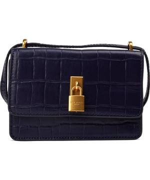 Embrace refined elegance with the SSLOANE handbag by Ted Baker. For those who appreciate the art of accessorising, this compact yet statement-making bag is a win-win. From keys and cards to your favourite lip gloss, everything finds its place within the compact yet functional interior. Magnetic closure, a zip pocket and golden hardware keep you organised and glam. Carry your necessities in the ultimate Ted Baker London style with this must-have accessory.