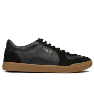 The sleek Coach Ellis trainers combine luxury and practicality. Crafted with premium black leather, these court-style trainers offer a sophisticated casual look that pairs with virtually anything. The durable rubber sole provides reliable traction while maintaining comfort for all-day wear. Simple yet refined, these womens trainers feature subtle Coach brandingâan understated statement piece that elevates your everyday style without trying too hard.