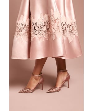 Exquisite satin court shoes featuring delicate mesh bow detailing on the pointed toe
        Elegant ankle strap with adjustable buckle fastening for a secure fit
        Sophisticated high stiletto heel measuring between 7-9cm for a striking silhouette
        Pointed toe design with intricate woven pattern adds a touch of refined glamour
        Versatile design perfect for formal occasions and evening events
    
    The Sophia Satin & Mesh Bow Detail Court Shoes from Coast are the epitome of sophisticated occasion wear. The striking stiletto heel creates a graceful silhouette whilst the delicate mesh bow detailing on the pointed toe adds a contemporary twist to a classic design. These shoes shine at weddings, race days and formal gatherings where attention to detail matters. Style them with a flowing midi dress featuring lace embellishments for a coordinated aesthetic, or pair with a tailored jumpsuit for a modern take on formal dressing. The ankle strap provides both security and style, allowing you to dance the night away with confidence. These court shoes will become your go-to choice for events where you wish to make a refined statement without compromising on comfort.