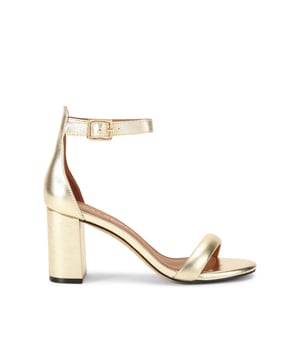 This Kurt Geiger Langley is a gold leather block heel. There is a gold padlock detail on the ankle straps. Heel height: 11.5cm.