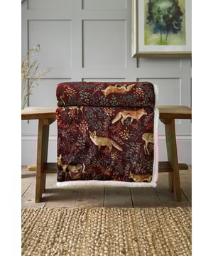 Bring warmth and woodland charm into your home with the Fox & Deer Throw in rich mulberry. Showcasing graceful woodland motifs, it adds a touch of nature-inspired style while keeping you cosy. The luxuriously soft fabric is lined with plush sherpa fleece, making it perfect for snuggling on chilly evenings. Designed by Deyongs in Great Britain, this throw combines elegant design, inviting colour, and lasting comfort.