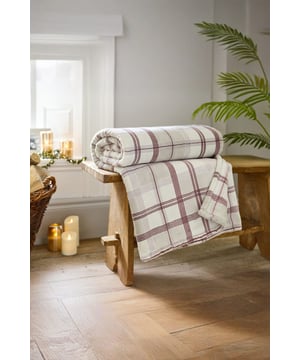 Classic and cosy, the Hounds Check Throw in burgundy is a versatile home essential. At 140x180cm, it’s generously sized to keep you snug, while the 500gsm printed coco flannel delivers exceptional softness and warmth. Its rich check design balances traditional charm with modern appeal, making it a perfect finishing touch for beds, sofas, or armchairs. Crafted from 100% polyester for durability and low-maintenance care.