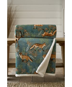 Infuse your room with a calming woodland feel with the Fox & Deer Throw in soothing green tones. Detailed with elegant fox and deer motifs, it brings nature indoors while surrounding you with cosy comfort. The ultra-soft fabric and sherpa fleece reverse make it a perfect companion for relaxed evenings. Thoughtfully designed by Deyongs in Great Britain, this throw delivers warmth, style, and durability.