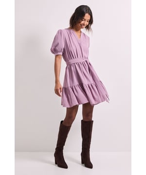 Flattering V-neckline with elegant puff sleeves for a feminine silhouette
        Belted waist design that accentuates your figure while providing adjustable comfort
        Tiered ruffle hem adding playful movement and dimension to this mini dress
        Versatile overhead style with a relaxed fit through the body
        Soft woven fabric that drapes beautifully for all-day comfort
    
    This charming Dorothy Perkins mini dress combines contemporary style with effortless wearability. The puff sleeves create a delightful vintage-inspired look, while the belted waist offers a customisable fit that flatters your natural shape. Perfect for casual gatherings, the tiered hem adds a touch of playfulness to your ensemble. Style with knee-high boots for a trendy daytime look, or pair with ballet flats and a denim jacket for weekend brunches with friends. The V-neckline provides a modest yet stylish detail that works beautifully with delicate jewellery. This versatile piece transitions seamlessly from family gatherings to baby showers, offering the ideal balance of comfort and style. The easy-to-wear silhouette makes it a wardrobe essential that you'll reach for time and again throughout the seasons.