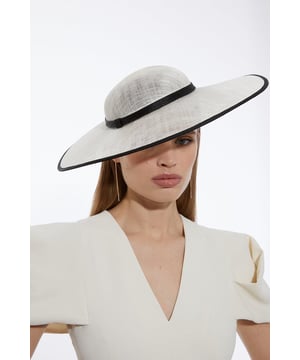 Get dressed up and finish an occasion look with a fascinator, with a statement, asymmetric design and a hat style, fitted onto a comfortable headband. Styles perfectly with a dress or pantsuit in matching tones for a look ideal for wedding guest days and days at the racecourse. Grosgrain Trim Large Disc Fascinator High Quality Grosgain Fabric Classic Hat Style Sleek, Minimal Design Round, Structured Base Statement, Large Size Comfortable Headband BaseBrowse this seasons women's fascinators or discover the full range of women's accessories now.