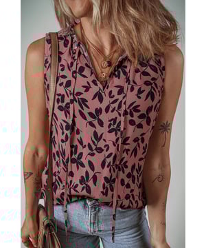 Top sin mangas con impresión de hojas marrones  
Cuello en V partido con detalle de encaje  
Tejido arrugado para agregar textura  
Combina bien con jeans o pantalones cortos  
Disponible en tallas S a XL  
Material: 100% Viscosa