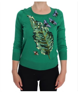 Marca: Dolce & Gabbana.
  Sueter de jersey.
  Cuello redondo.
  Manga larga.
  Color: Verde.
  Adornado con apliques multicolor de mariposa y hoja de platano.
  Detalles de cristales.
  Hecho en Italia.
  Detalles del logotipo.
  Material: 100% seda.
  Artesania exclusiva y de alta calidad.