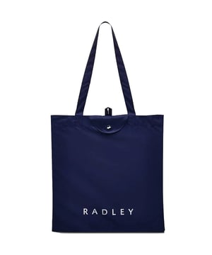 This clever Radley shopper transforms from pocket-sized companion to spacious 36x37cm tote in seconds. Crafted from durable polyester in a striking blue shade, it features twin handles for comfortable carrying and tucks away neatly when not in use. Perfect for spontaneous shopping trips or as your trusty backup bag, complete with signature Radley branding for that touch of British style.