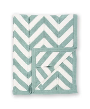 100% organic cotton | Proud to be certified to the Global Organic Textile Standard (GOTS) | Soft spruce green and cream chevron knit | 5-gauge midweight transfer knit | 70 cm x 90 cm | Made in India | Machine washable at 40 degrees, or at 30 degrees to be kinder to the planet