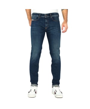 Elevate your wardrobe with the Diesel 1979 Sleenker Dark Blue Denim Pants, crafted for men who value both style and comfort. Made from a premium blend of 98% cotton and 2% elastane, these jeans offer a perfect fit with just the right amount of stretch. Featuring a classic five-pocket design, they combine timeless appeal with practical functionality. The rich dark blue wash adds versatility, making them ideal for casual outings or smart-casual occasions. Experience durable quality and contemporary style that Diesel is renowned for, ensuring these pants become a staple in your everyday collection