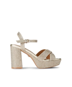 This Carvela Sonata Platform heel is crafted from a gold crystal embellished fabric. There is a gold tone buckle on the ankle strap. Heel height: 10cm. Platform height: 3cm.