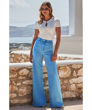 Elevate your denim Designed in a super wide-leg fit for an on-trend silhouette Crafted from our signature soft stretch denim Statement bold blue wash Effortlessly cool with a white vest and barely-there heels Complete the look with a chic cropped jacket Inside leg to fit: Short 29" | Regular 31" | Long 33"