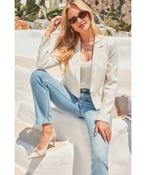 Consider your outfit upgradedCrafted from the chicest boucle fabricCinched at the waist with a luxe pearl buttonCut to a flattering cropped lengthDo relaxed glamour with denimPairs perfectly with high-waist wide-leg trousers