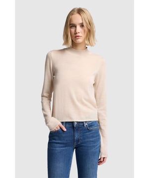 Damen  Unser langärmeliger Rollkragenpullover gehört zu den Kleidungsstücken, die nie aus der Mode kommen. Er ist aus rosa Kaschmir gefertigt und verleiht Jeans im Vintage-Look einen luxuriösen Touch.