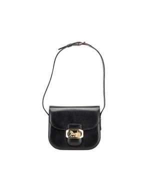 Features a main compartment.
  Comes with an adjustable strap.
  Designed with a flap closure.
  Crafted from leather.
Material: Leather
