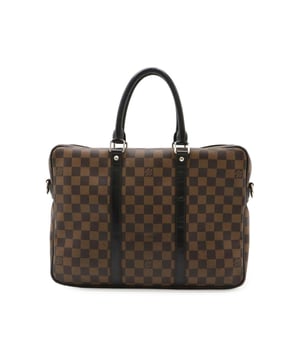 Crafted from coated canvas
  Features leather trim
  Designed with double handles
  Ideal for carrying business essentials
  Offers style and functionality
Material: Canvas