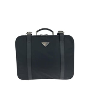Textile briefcase
  Features a top handle
  Includes buckle closure
  Internal pocket
  Great for carrying essentials
Material: Leather