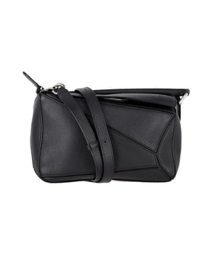 Geometric paneled design adds visual interest.
  Adjustable strap for versatile wear.
  Convertible style for multiple carrying options.
  Crafted with quality leather for durability.
  Ideal for everyday use and special occasions.
Material: Leather | Calfskin leather