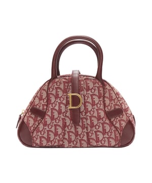 Features a dome
  shaped design.
  Equipped with a top handle.
  Accented with a unique pattern.
Material: Canvas