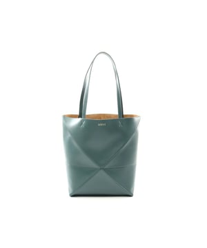 Crafted from leather
  Features an interior compartment
  Tote bag style
  Versatile design for multiple occasions
Material: Animal skin | Calfskin