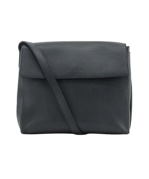 Features a crossbody design.
  Equipped with a flap closure.
  Adjustable strap for custom fit.
  Designed with an internal zip pocket.
Material: Leather