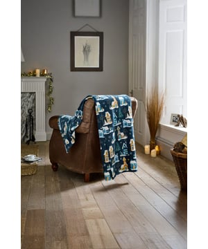 Create a warm and inviting seasonal look with the Festive Village Fleece Throw. Designed with a charming snowy house and tree print on navy, this throw is crafted from super-soft 240gsm coral fleece for cosy comfort. Lightweight, warm, and easy to wash, it’s made from 100% polyester for durability and everyday use. Perfect for sofas, beds, or armchairs, this winter blanket is an easy way to bring festive style to your home.