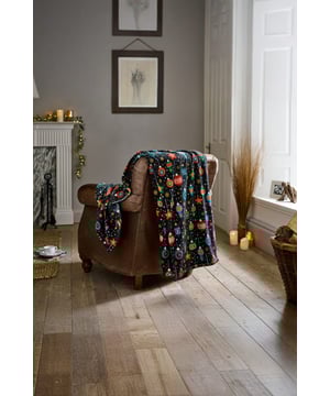 Add festive cheer to your home with this Christmas Baubles Fleece Throw. Featuring a bright bauble design on a rich navy background, this blanket is made from 240gsm coral fleece for a soft, cosy feel. Lightweight yet warm, it’s perfect for snuggling on the sofa, adding a seasonal touch to your bed, or gifting during the holidays. Durable, easy-care 100% polyester makes it practical as well as stylish.