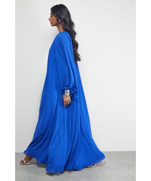 Elegant high neck design with delicate keyhole detail at front and back
        Flowing trapeze silhouette creates dramatic movement with every step
        Full-length maxi cut offers sophisticated coverage for formal occasions
        Billowing long sleeves with subtle tie detail at cuffs for refined finishing
        Lightweight chiffon fabric drapes beautifully for an ethereal effect
    
    Make a striking entrance in this captivating chiffon maxi dress from Warehouse. The high neck design and flowing trapeze silhouette combine to create a look that's both dramatic and refined. Perfect for weddings, formal events or summer soires, this dress commands attention whilst maintaining an air of sophistication. Style with metallic strappy sandals as shown for an elegant evening ensemble, or dress down with delicate flat sandals for daytime occasions. The billowing sleeves with tie details add movement and interest, whilst the keyhole openings at front and back offer subtle glimpses of skin. Complete your look with statement earrings and a sleek clutch bag to showcase the dress's clean lines and flowing silhouette. This versatile piece transitions effortlessly from day to night with a simple change of accessories.