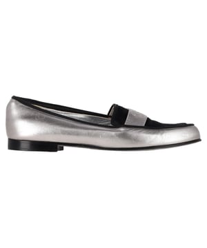 VINTAGE, RRP AS NEW
Make a bold statement with the **Chanel CC Loafers** in striking metallic silver and black leather, finished with the iconic interlocking CC for a luxe edge. These loafers fuse classic tailoring with futuristic flair, perfect for elevating both casual and formal looks. **Style tip:** Style them with black cigarette pants and a structured blazer for a sleek, fashion-forward ensemble with Parisian polish.

 Chanel CC Loafers in Metallic Silver and Black Leather

Condition: Very good
Signs of wear: Minor markings, Lightly used but very well maintained. Minor mark at soles & creasing, light scuffing at the soles and heels.
Packaging: None
Color: Metallic | silver
Material: Leather | leather
Size: FR | 37.5
Measurements: Heel height: 20; Insole length: 270
SKU: NAPPUGBSH534100W