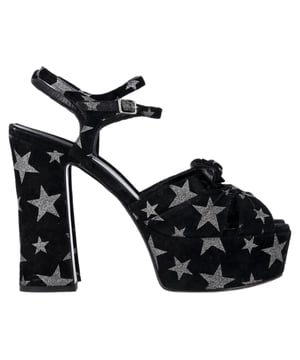 VINTAGE, RRP AS NEW
Turn heads with every step in the Saint Laurent Candy Platform Sandals, a dazzling blend of retro glamour and modern edge. Crafted in black suede and adorned with silver glitter star prints, these statement heels feature a towering platform, ankle strap, and peep toe silhouette. A perfect nod to '70s disco with unmistakable Saint Laurent attitude.


Saint Laurent Candy Star Print Platform Sandals in Black Suede
Condition: Very good
Signs of wear: Include Box., Minor markings, Lightly used but very well maintained. Minor mark at soles & creasing, light scuffing at the soles and heels.
Packaging: Box, Dust bag
Color: black
Material: suede
Size: EU | 38.5
Measurements: Heel height: 125; Insole length: 270
SKU: TONPUGBSH507645W